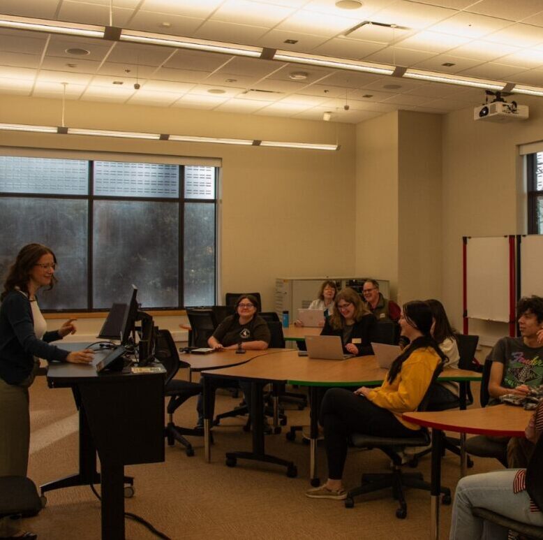 students in the lower level of Coe Library at a table