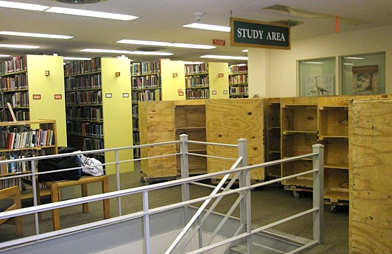 Empty shelving carts during construction of Coe Library.