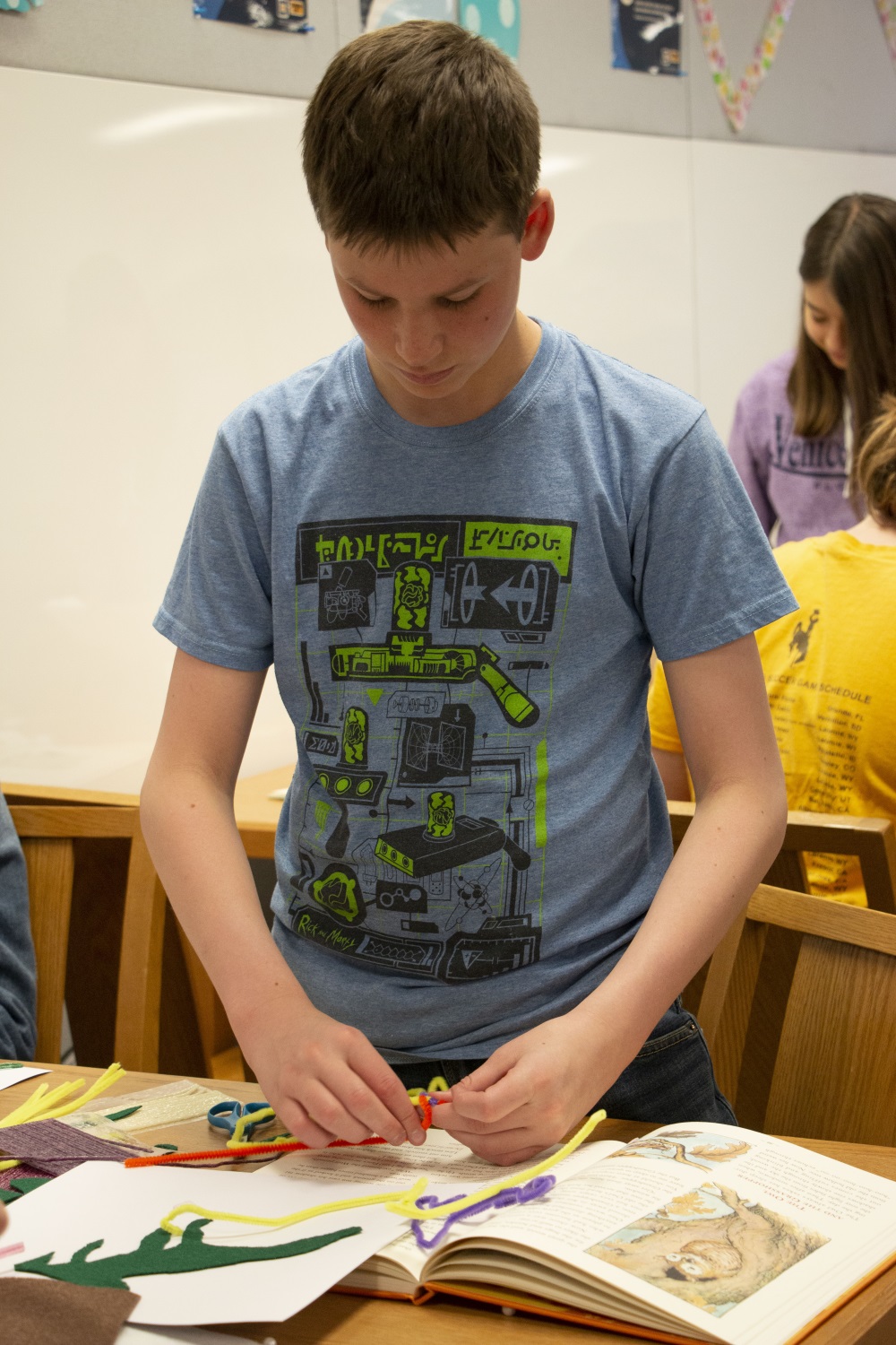 student using crafts to make an accessible book