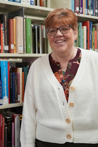 Tadi Valdez in the stacks of Coe Library