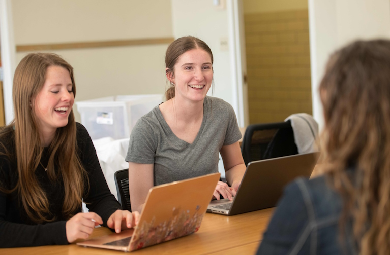 students in a classroom laughing