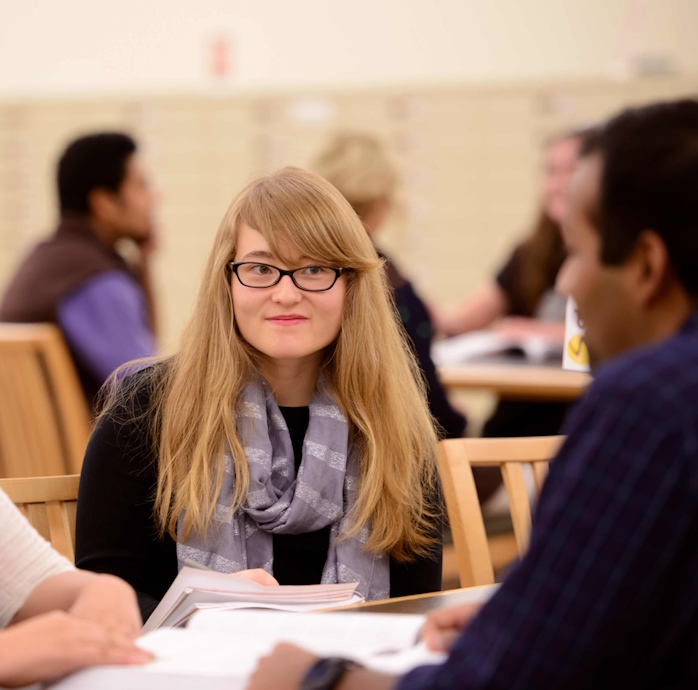 students in the lower level of Coe Library at a table