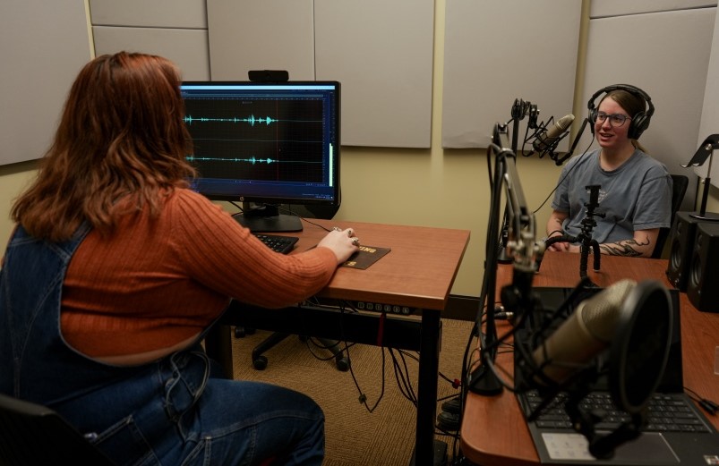 Two students using the Studio Coe audio recording space.
