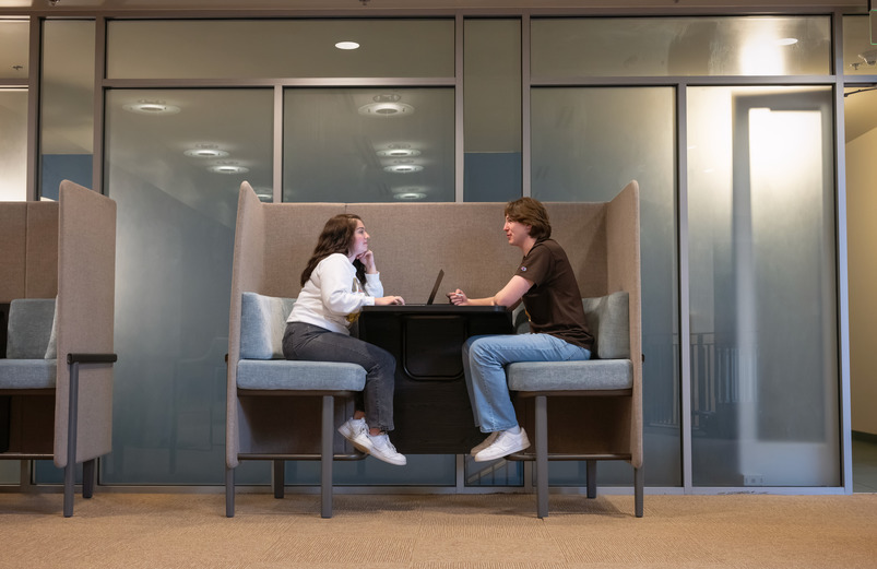 Two students in a study space