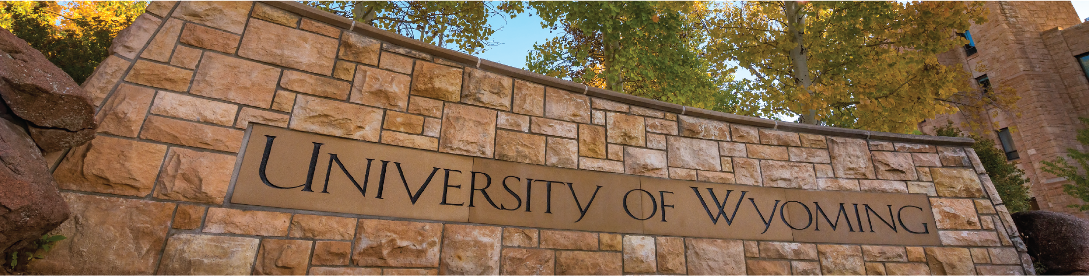 Image of "University of Wyoming" stone sign in the circle drive outside the Wyoming Union