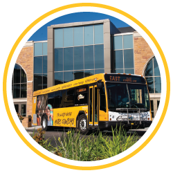 University of Wyoming bus in front of the Arena Auditorium