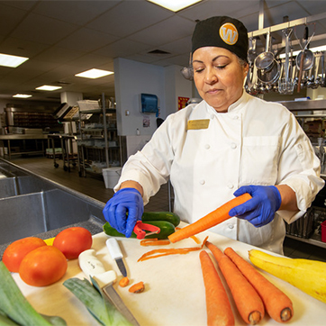 Chef cooking food on campus