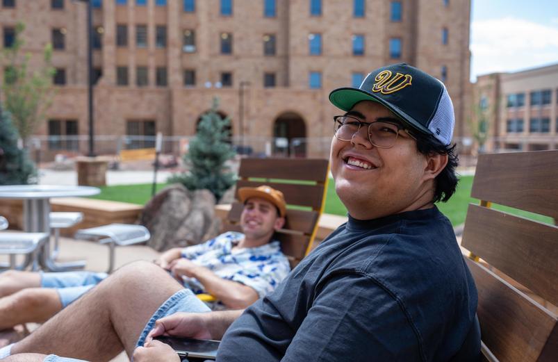 Student sitting outsite of North Hall