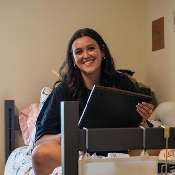 Student hanging out in their residence hall