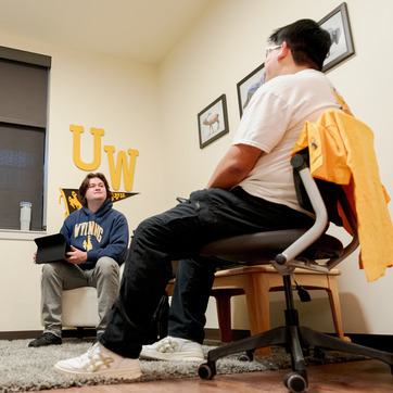 Roommates hanging out in their residence hall