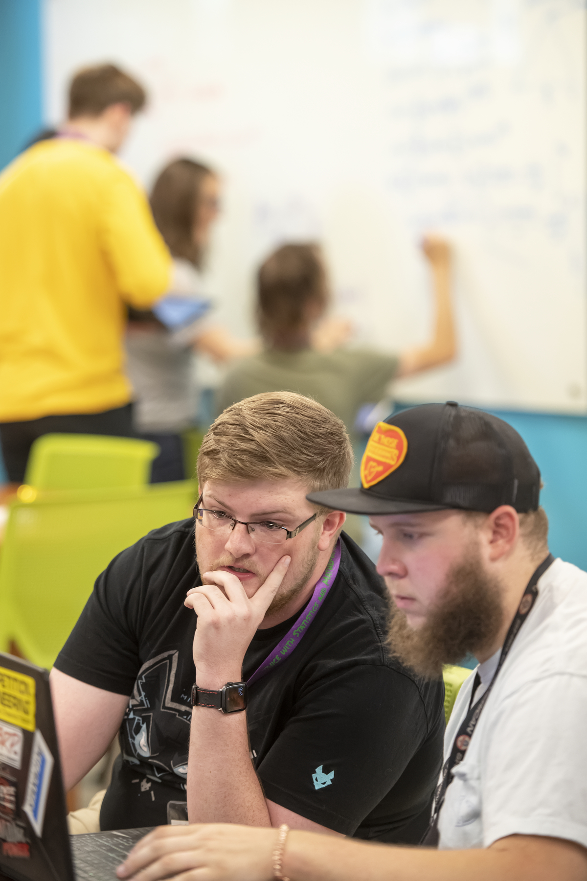 Tutor and student working at a computer