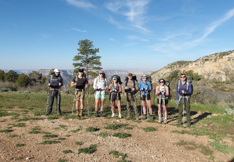 Students standing in a row after a hike in the Teton National Forest during the Jackson Leadership Summit