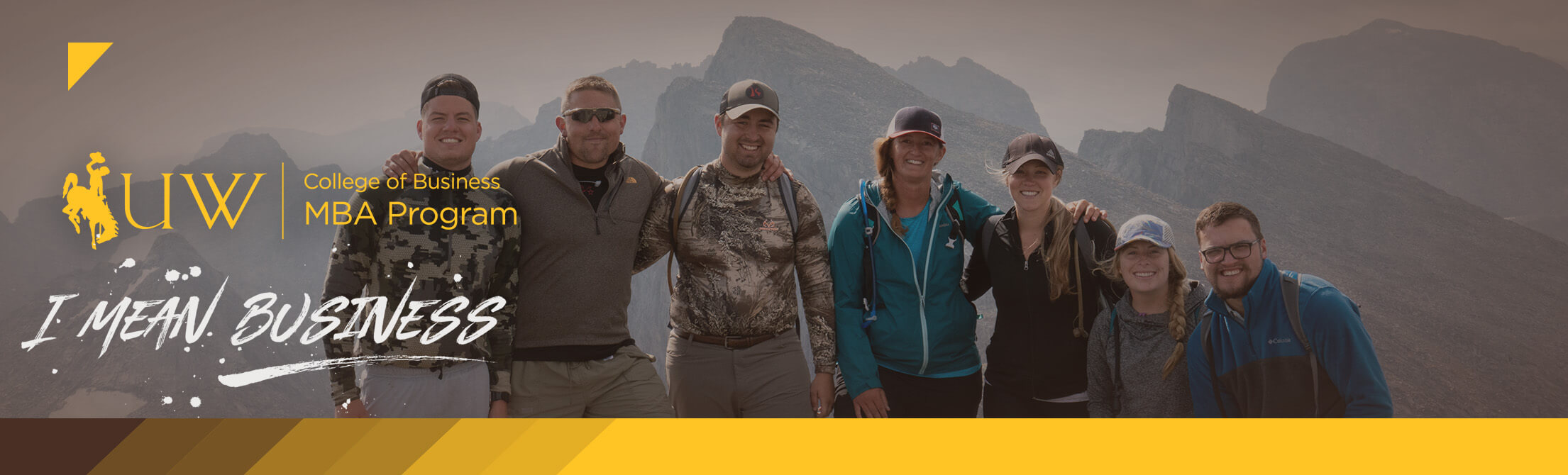 Photo of MBA Students Standing Together On Top of a Mountain