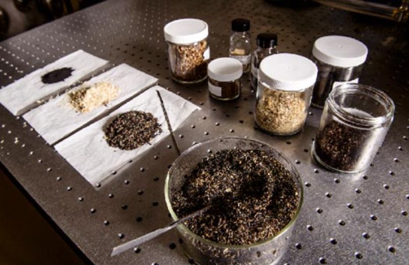 Raw and pretreated solid fuels, including pulverized Powder River Basin coal and beetle-kill lodgepole pine sawdust, are shown. Pretreatment techniques, include mild pyrolysis called torrefaction, alters the raw wood such that it more closely resembles coal in composition and conversion.