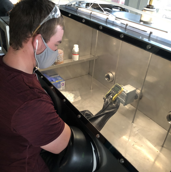 doctoral student conducts research on lithium ion batteries in laboratory