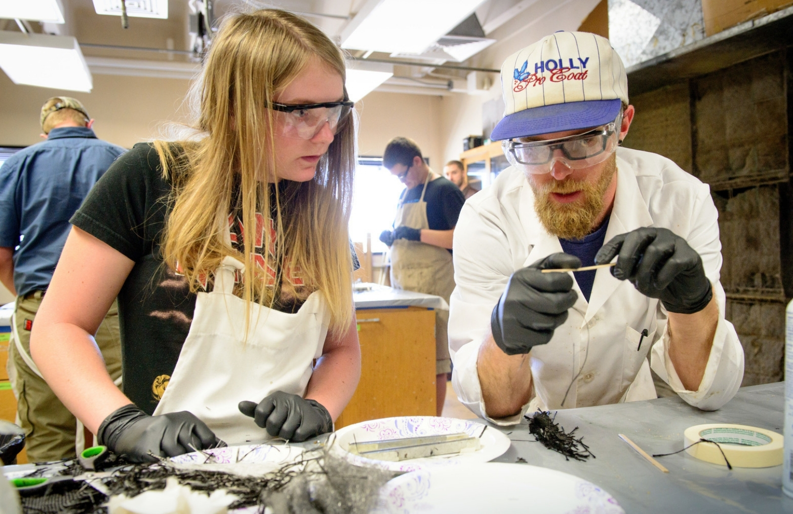 two mechanical engieering students work in the composites manufacturing lab