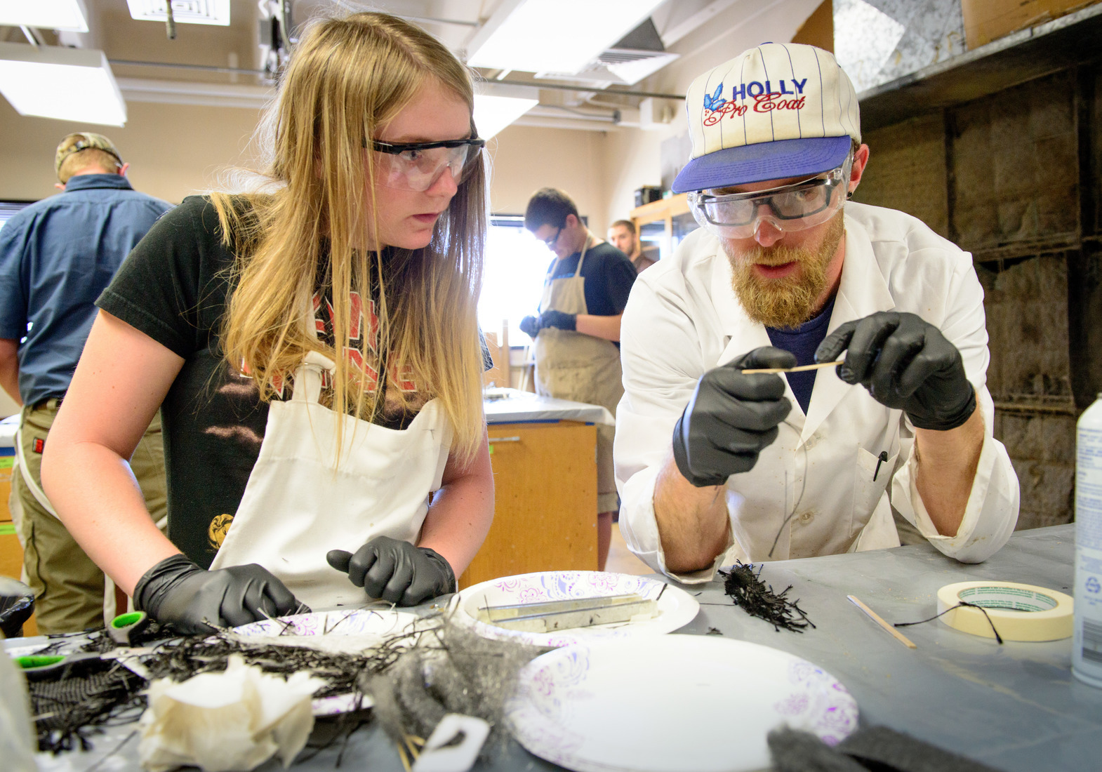 two mechanical engieering students work in the composites manufacturing lab