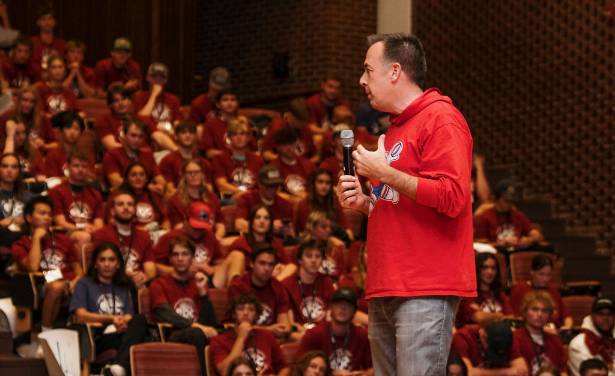 speaker in front of a full auditorium at the mwrs