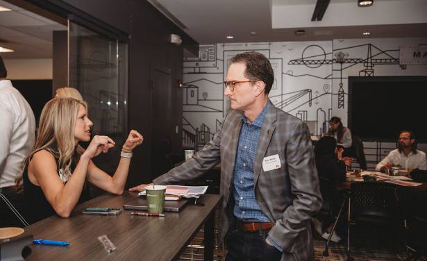 two people speaking at the reception at the mwrs