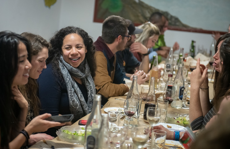 several people dining at a table