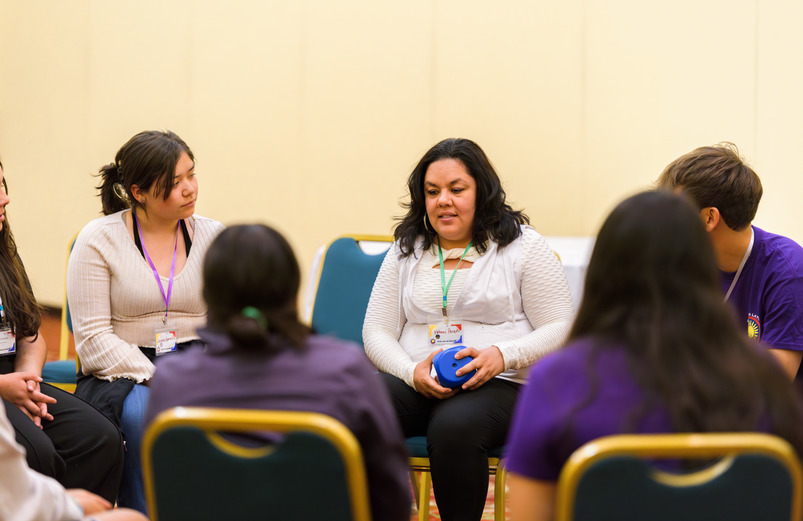 Woman participates in activities during the Latina Conference.
