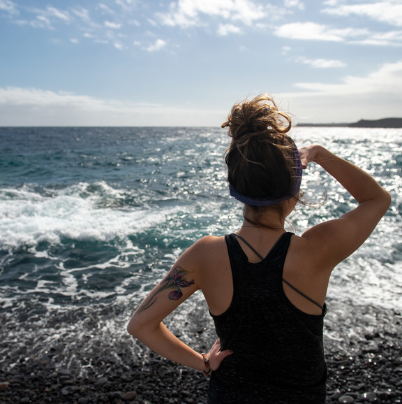 Student gazing at the ocean