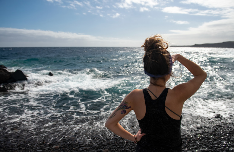 Student gazing at the ocean
