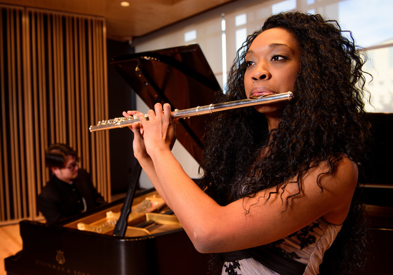 Flautist performing on stage