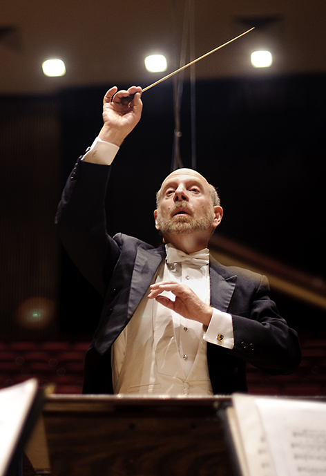 Photo of Symphony Orchestra director Dr. Michael Griffith conducting during a concert
