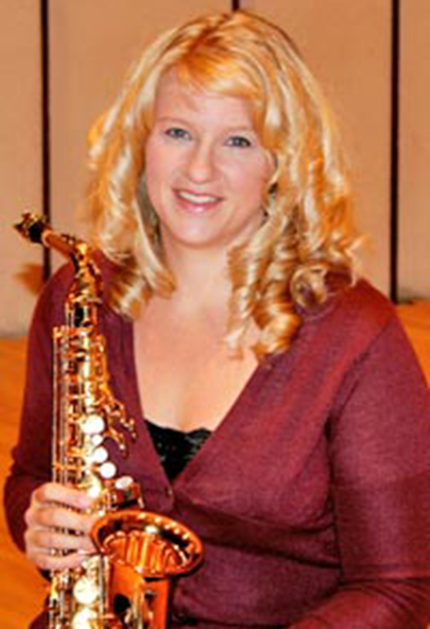 Photo of Dr. Jennifer Turpen holding a saxophone