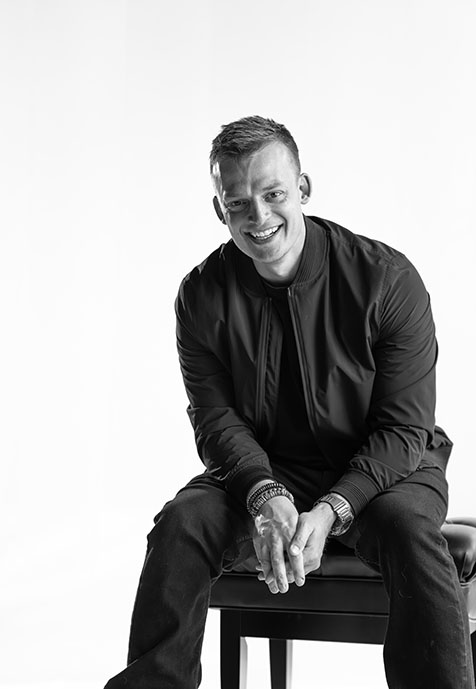 Black and White Headshot of Andy Wheelock sitting down