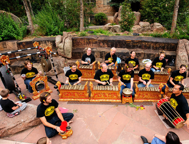 2015 Gamelan concert in Simpson Plaza outside the Wyoming Union, 12 members of Candra Wyoga are playing the brass instruments.