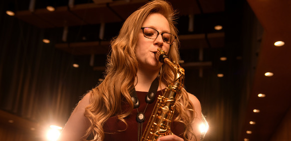 Saxophonist perfroming in the recital hall
