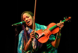 performer sings into microphone