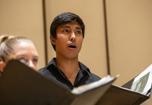 student sings in chior