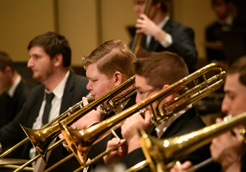 Brass players performing during a jazz concert