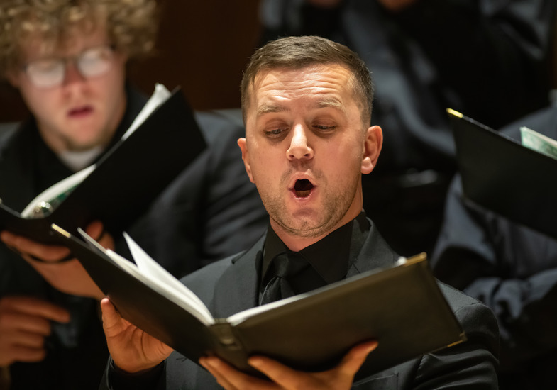 Man singing during choral concert