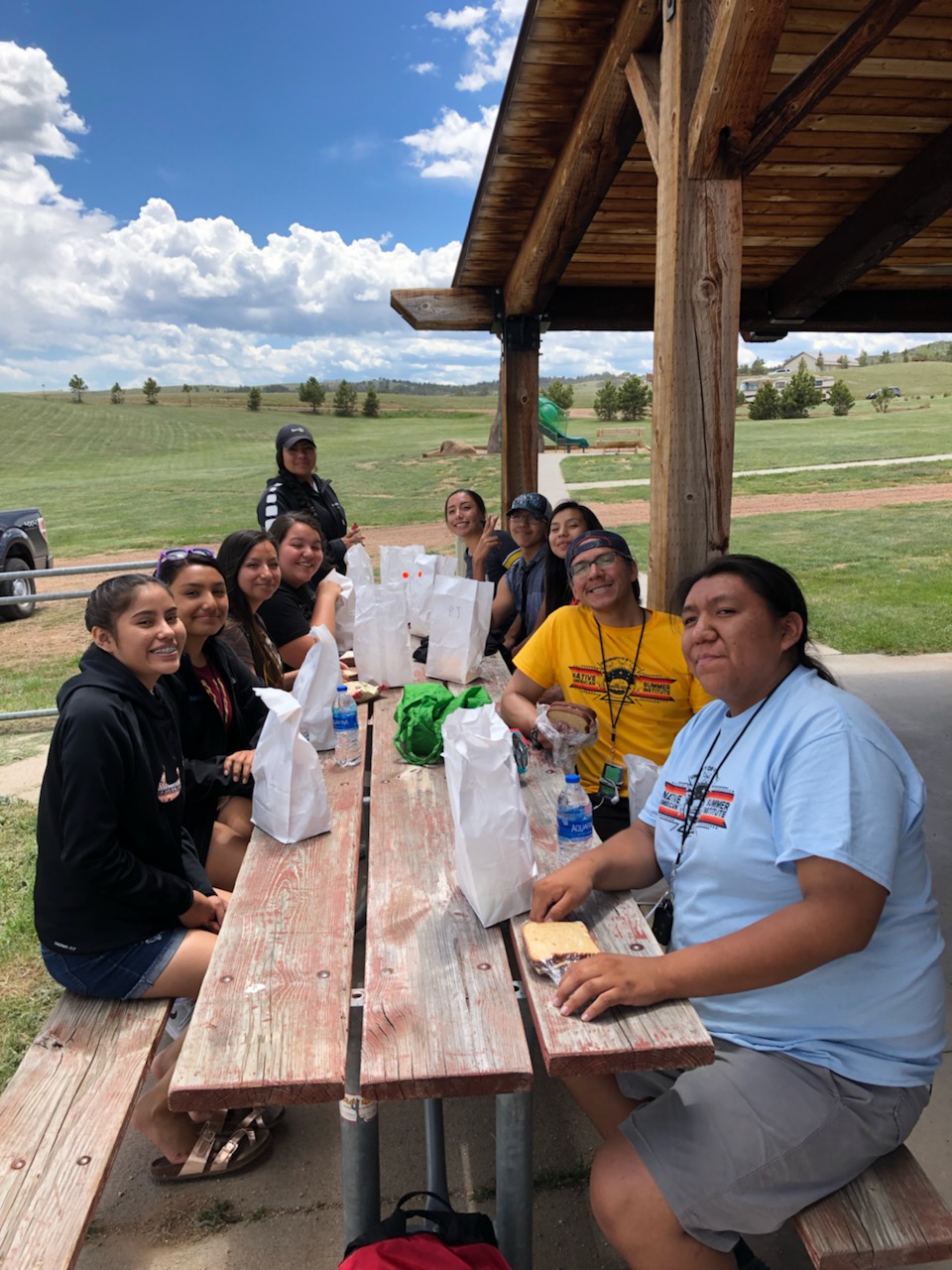students have lunch outside in wyoming summer weather