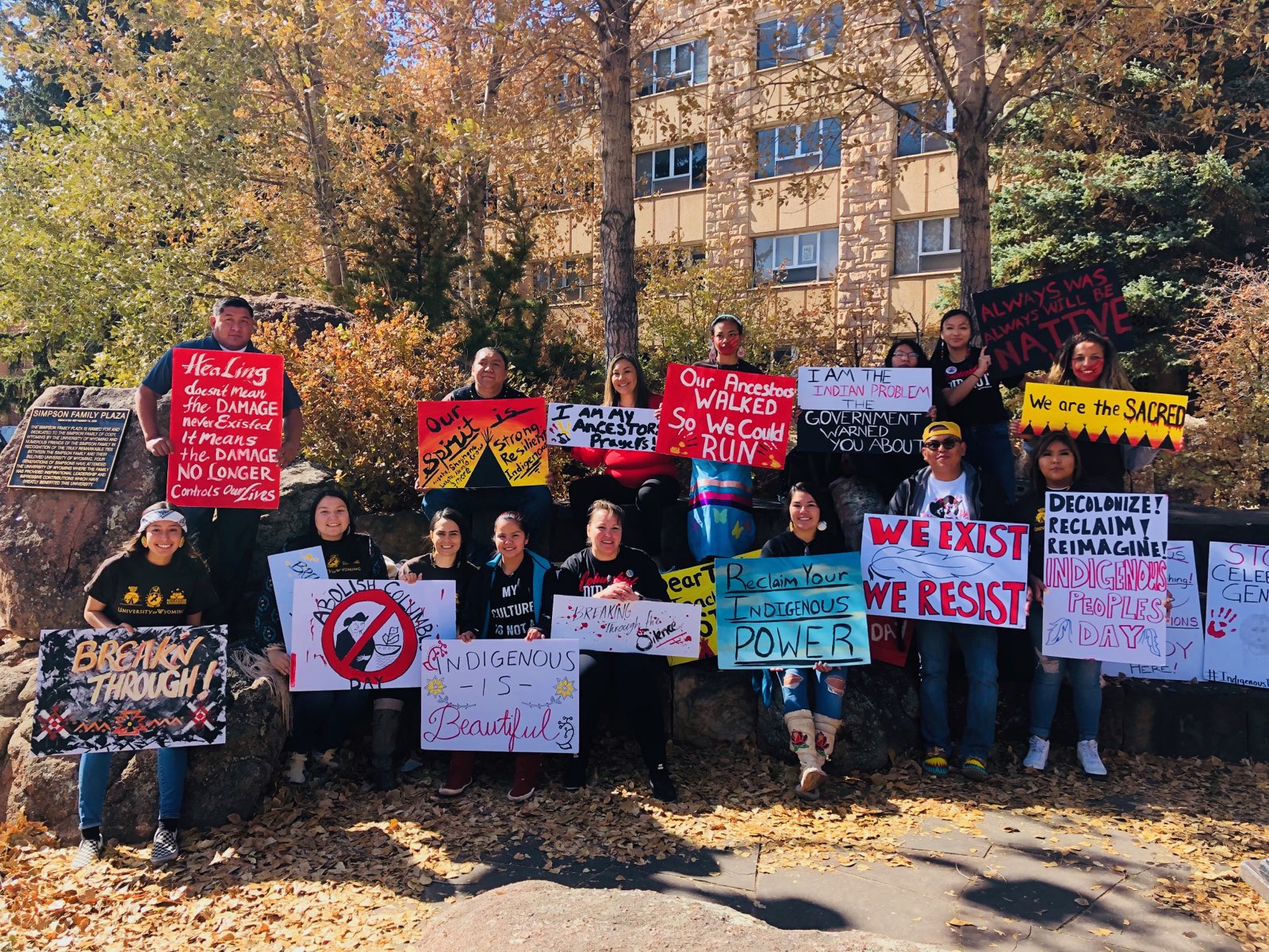 keepers of the fire students with signs