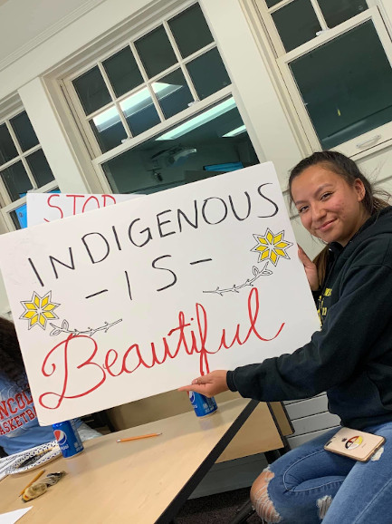 student with sign