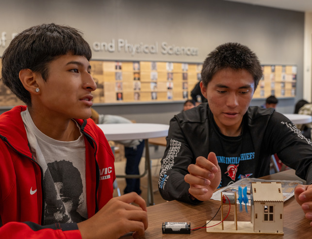 Two Native American students working on an engineering project