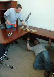 Men building desk