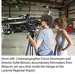Cinematographer Fairuz Ghammam and director Sofie Benoot,  documentary filmmakers from Belgium, set up a shot inside the hangar at the Laramie Regional Airport.