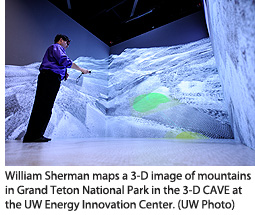 William Sherman maps a 3-D image of mountains in Grand Teton National Park in the 3-D CAVE at the UW Energy Innovation Center. (UW Photo)