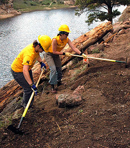 Two students working on river bank