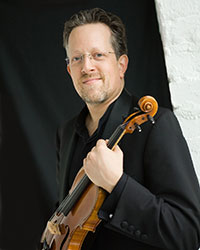 man holding a violin