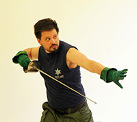 man posing with sword