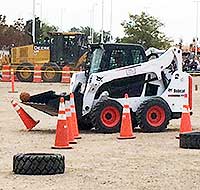 bobcat front-end loader scooping basketball off traffic cone