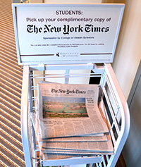newspaper stand containing copies of the New York Times