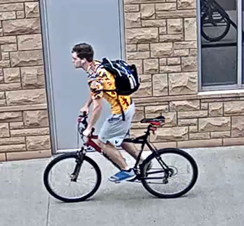 young man riding a bike